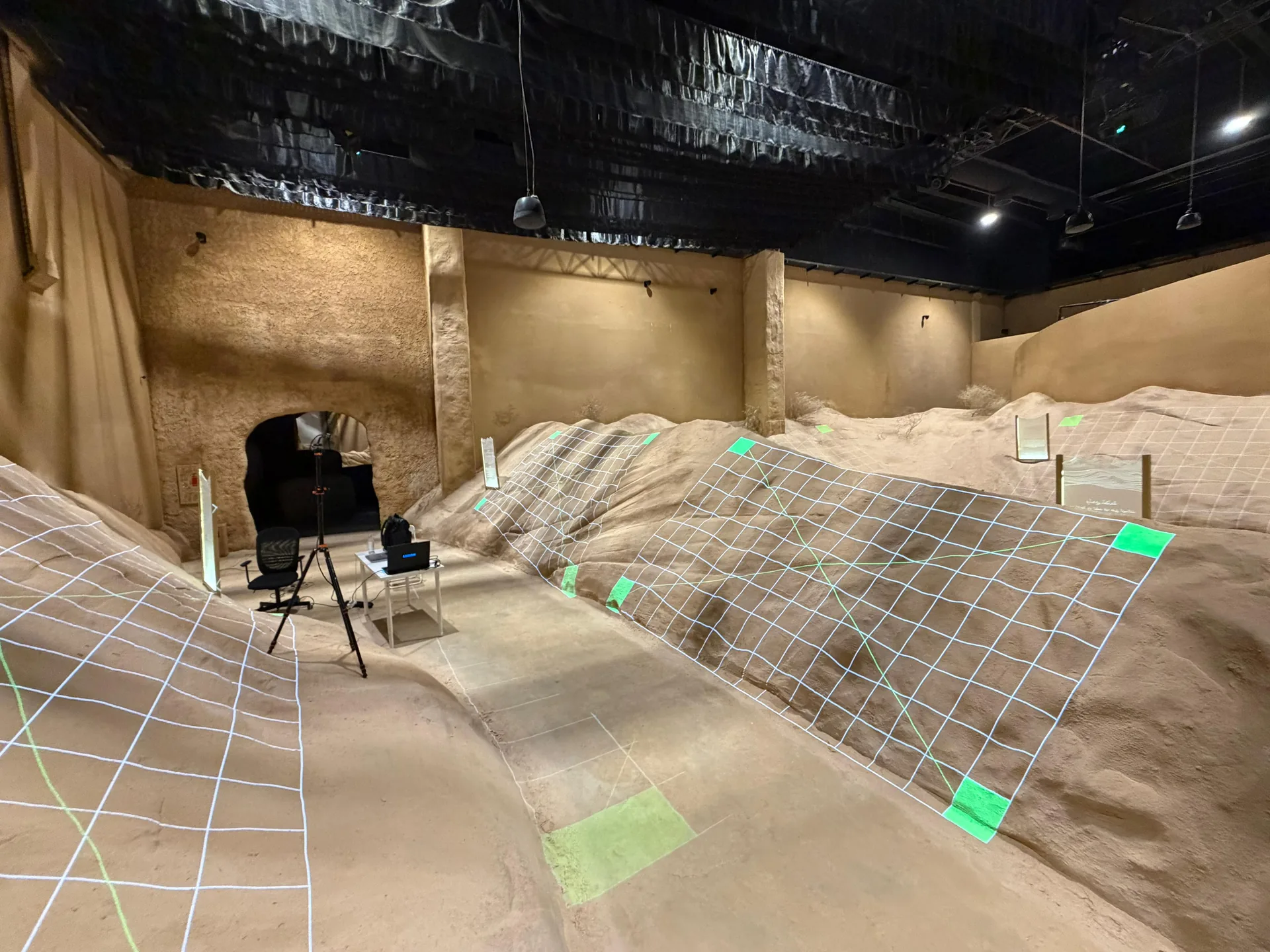 Projection calibration grids across irregular rock-like scenic surfaces.